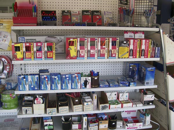 Writing and everyday office supplies arranged on a shop shelf