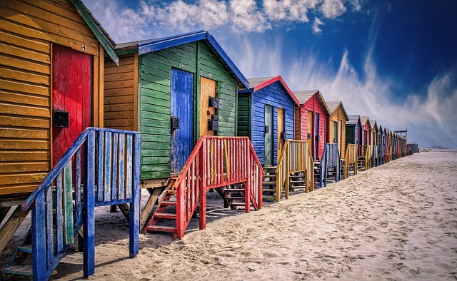 Colorful cabins along a beach